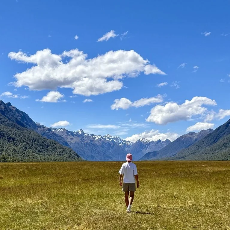 James walking through a mountain valley